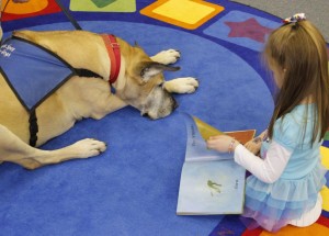 Pre-K child reads to Lilo