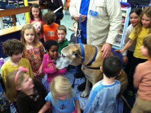 Children in the K-1 classes meet their Reading Buddy Tucker