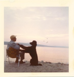 My father's nightly post on the beach (Long Lake) with his special dog Talley at his side, ready to enjoy the sunset.