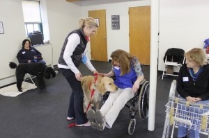 Susan and Shadow in background waiting for a turn with the equipment used in class.