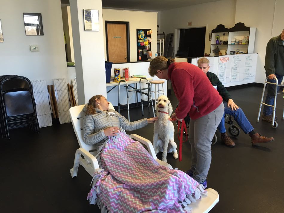 one class participant role-plays a patient in bed while another participant practices the skill of approaching a patient in bed.